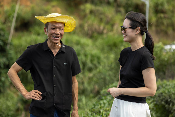Pink Luk with a tea farmer in his garden in Anxi, Fujian, sourcing teas for the blind tasting club