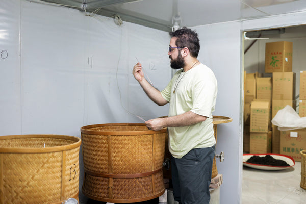 Nadi Biran is checking the progress of tea roasting, Chaozhou, Guangdong