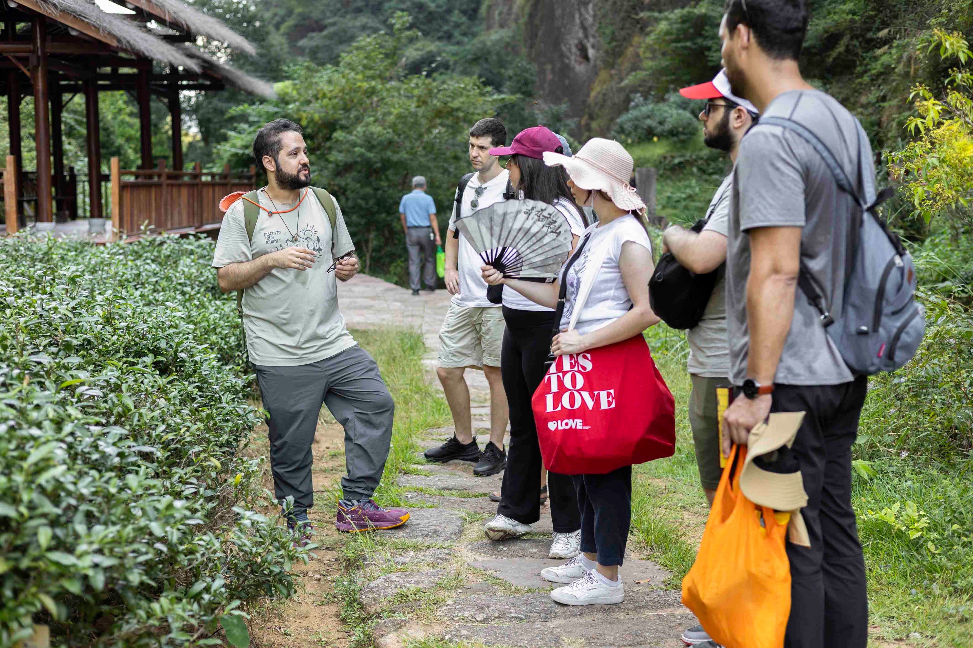 Nadi is guiding a travel group in Wuyi Shan Zhengyan hiking trail