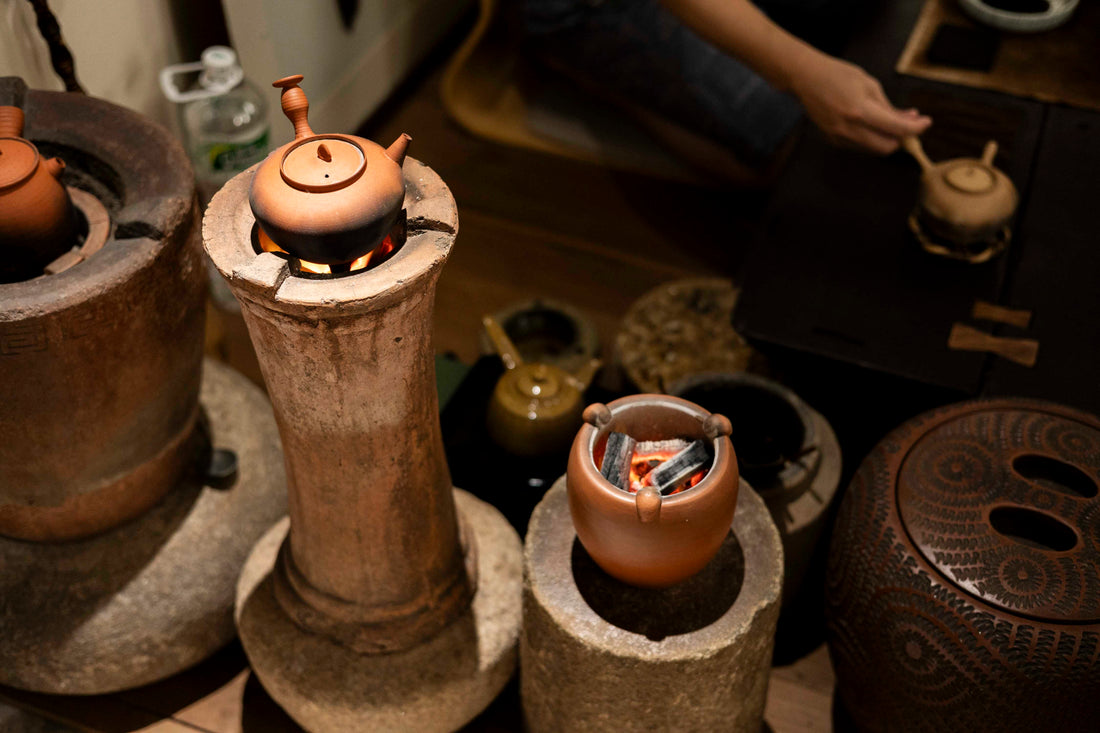 Chaozhou ging fu cha tea ceremony in the ancient city using traditional charcoal clay kettle