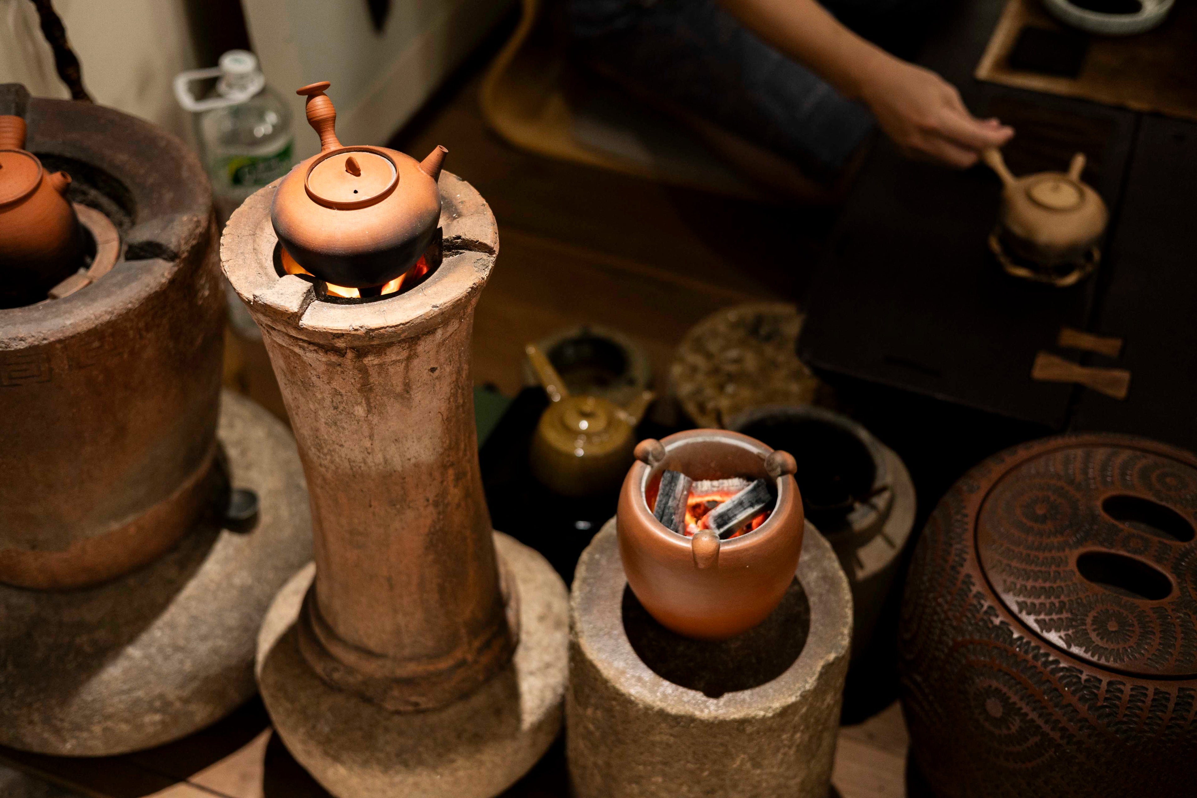 Chaozhou ging fu cha tea ceremony in the ancient city using traditional charcoal clay kettle